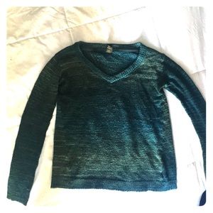 Green and blue sweater with detailed cut back